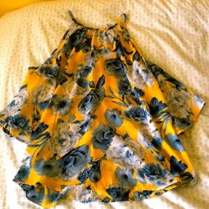 A yellow and blue blouse with open shoulders